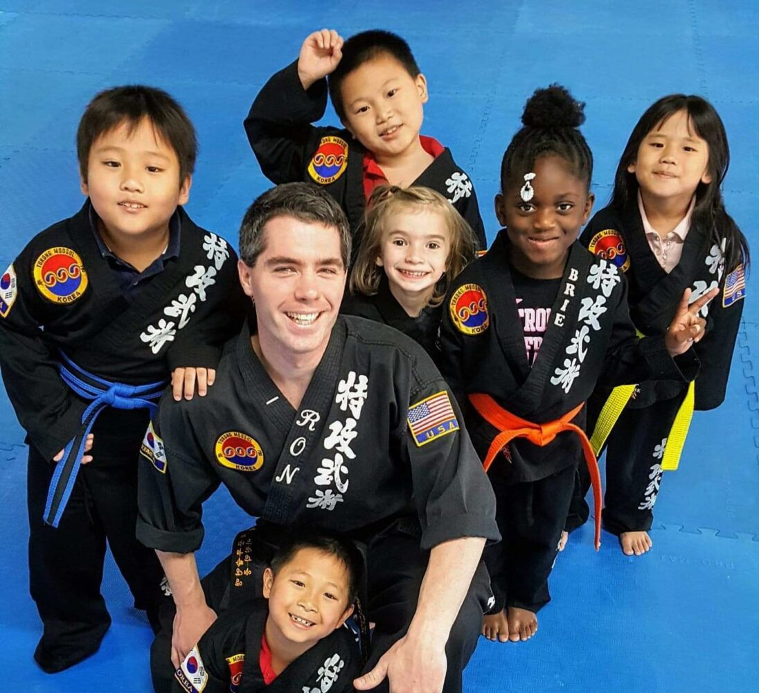 Tukong Austin instructor working with kids in martial arts class