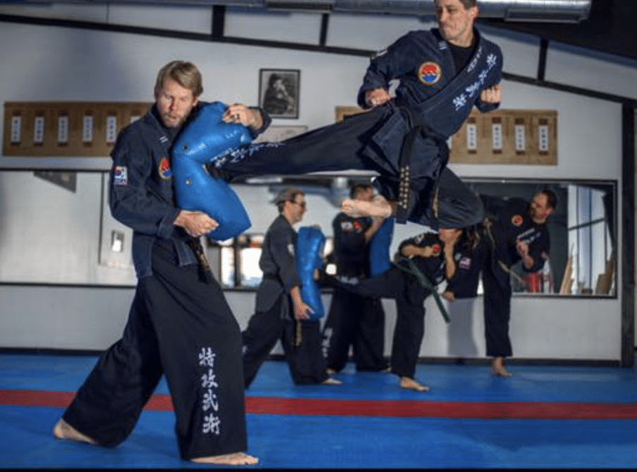 Adult student executing a flying side kick at Tukong Austin