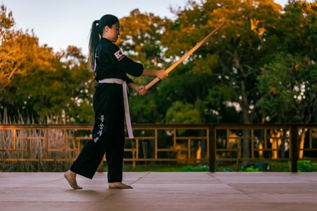 Tukong Austin student during weapons training with sword